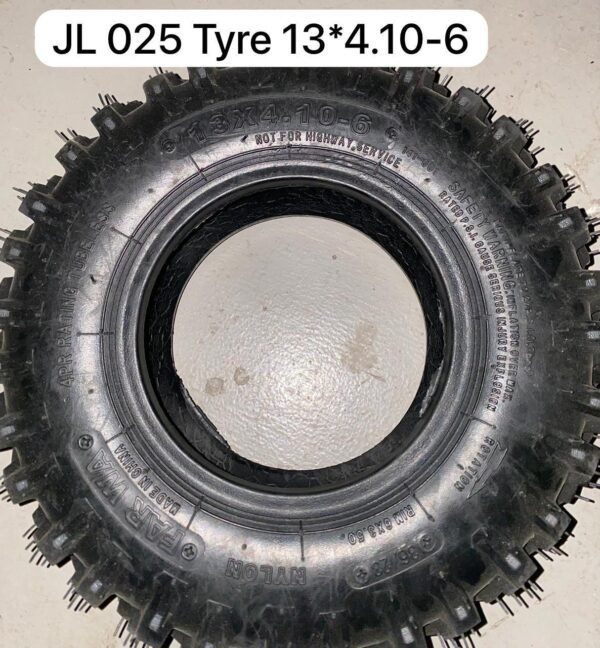 Black JL 025 13*4.10-6 off-road tire with aggressive tread pattern for superior grip